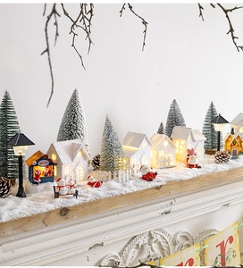 Luminous miniature Christmas snow house with candy store sign and small figurines