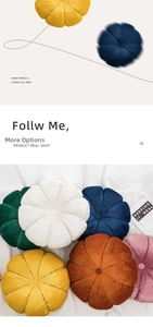 Detail of colorful velvet pumpkin-shaped cushions with pleated texture and center button
