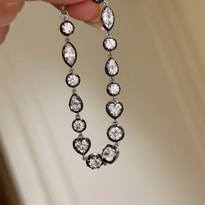 Elegant silver bracelet with multi-shape zircons featuring round, heart and pear cuts