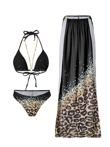 Detail of leopard print three-piece bikini set featuring metal chain straps and mesh skirt