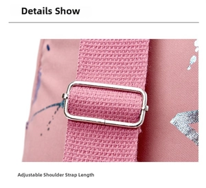 Detail of adjustable shoulder strap buckle on pink textured crossbody sports bag