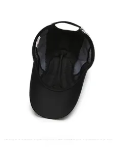 Internal view of black baseball cap showing breathable mesh fabric and lining details