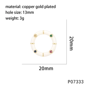 Detail of 20mm gold plated pendant with white enamel and multi-colored zircon stones