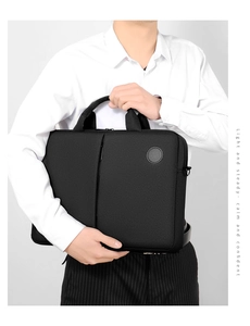 Business professional carrying a sleek black laptop briefcase for 15.6 inch computers