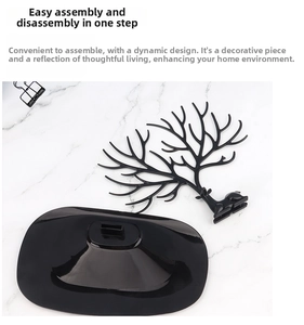 Overhead view of two-piece detachable black antler jewelry organizer on marble surface