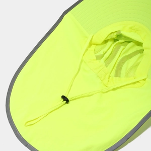 Detail of high-visibility yellow safety hat showing reflective trim and mesh lining