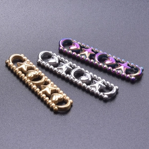 Detail of stainless steel heart and star jewelry connectors in gold, silver and rainbow