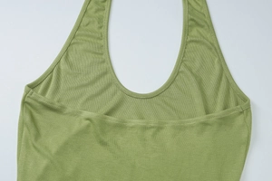 Detailed view of green halter neck sleeveless top showing soft ribbed cotton texture