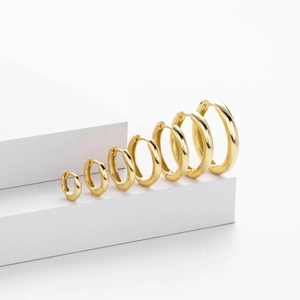 Minimalist S925 sterling silver gold hoop earrings set in six different sizes on white stand