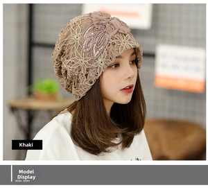 Close-up of khaki lace turban hat with floral sequins and elegant mesh embroidery detail