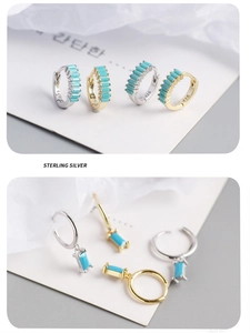 Macro detail of S925 sterling silver turquoise earrings with gold and silver finishes