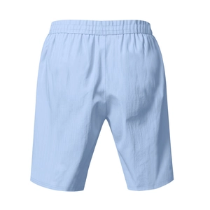 Detail view of the back of light blue linen shorts featuring a flexible elastic waistband