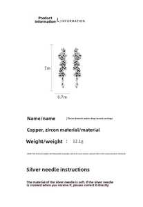 Detailed close-up of long zircon branch earrings with teardrop tassels and silver pins