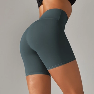 Detail of high-waist yoga shorts showing seamless texture and peach lift effect