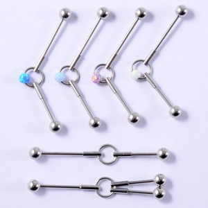 Macro detail of industrial barbell earrings with blue opal beads on steel bars