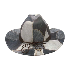 Close-up of patchwork denim cowboy hat with leather band and stitch detailing