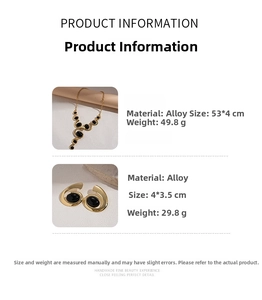Detailed view of vintage geometric gold necklace and earrings with black stones