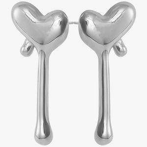 Macro shot of liquid metal heart drop earrings in polished silver stainless steel