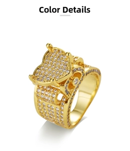 Detailed view of the large gold heart ring fully paved with sparkling white cubic zirconia