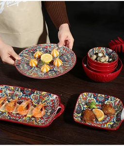 Bohemian ceramic dinnerware set featuring colorful mandala patterns on wooden table