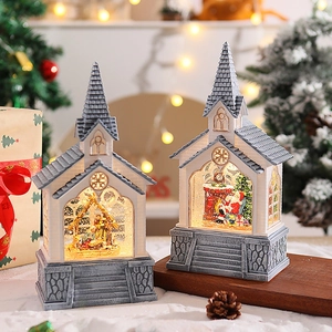 Detail of Christmas lantern with Santa and Nativity scenes, LED lights and swirling glitter
