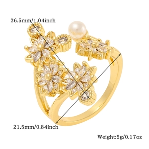 Detail view of gold floral ring dimensions and micro-set zircon stones on white background