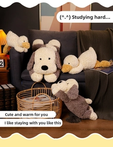 Close-up of soft plush puppy and duck toys in a cozy home setting with books