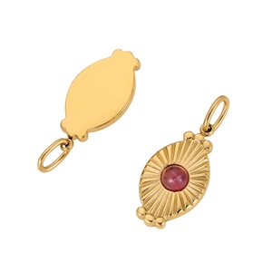 Detail of two gold stainless steel pendants with a red round stone and radial texture