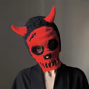 Detailed knit of red devil horns and skull pattern on a warm winter balaclava hood