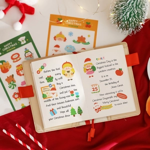 Christmas theme stationery set with Santa stickers on a beige leather journal cover