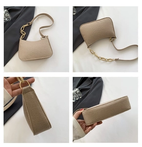 Detailed views of khaki faux-crocodile underarm bag with decorative gold chain strap