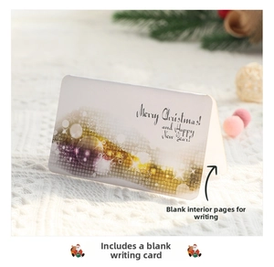 Close-up of a 3D Christmas card with gold Merry Christmas text on white knit background