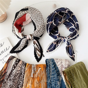 Pleated square silk scarf for women featuring multi-color patterns and elegant geometric prints
