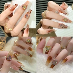 Long coffin press-on nails with amber brown gradient and luxury rhinestone jewels