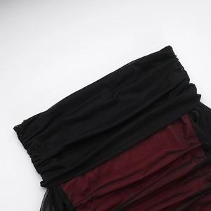 Detailed close-up of pleated black and wine red mesh fabric with delicate layered texture