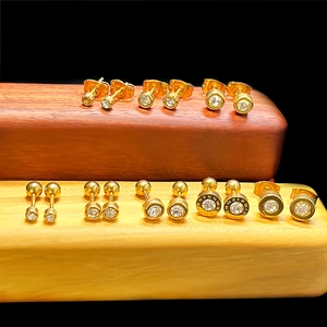 Golden titanium steel studs with round zircons and Roman numeral engravings in a set