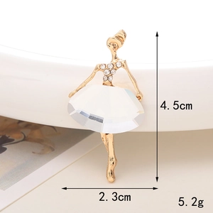 Detail view of a ballerina resin charm with golden base and white crystals showing 4.5cm size