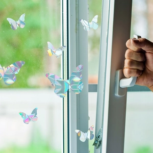 Detailed holographic butterfly window decals showing colorful rainbow prism reflections