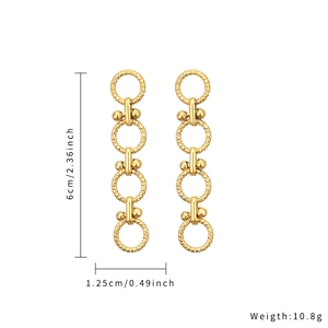 Detail view of gold geometric drop earrings with diamond texture showing 6cm length