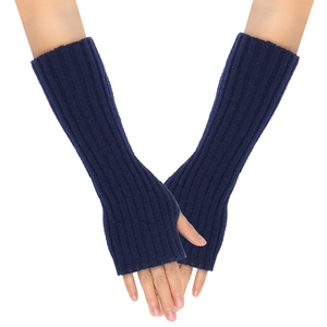 Detailed knit texture of navy blue fingerless long arm warmers shown on crossed arms