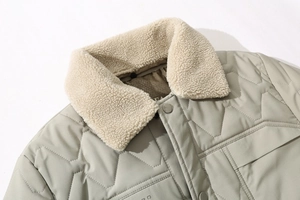 Detail of winter quilted coat featuring fleece collar and geometric stitching design