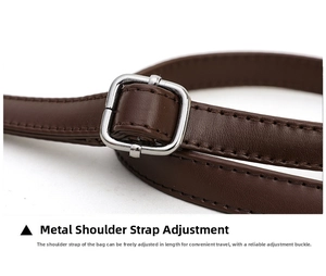 Detail of dark brown leather strap with silver buckle and precision stitching detail