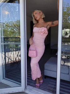 Pink strapless bodycon dress with 3D rose detail and ruched midi length skirt