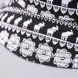 Close-up of canvas sun hat featuring elephant patterns and tribal geometric prints