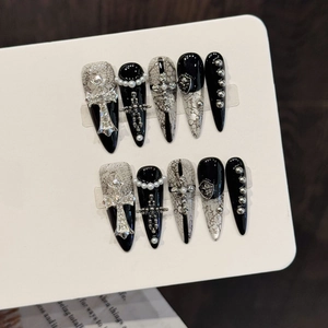 Gothic Y2K style handmade press-on nails featuring silver cross and lace patterns