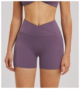 Close-up of cross V-waistband on purple yoga shorts with matte texture and flat seams