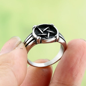 Vintage stainless steel pentagram ring for men with a distressed silver and black finish
