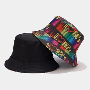Detail of reversible 80s neon graffiti print and plain black cotton bucket hat