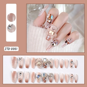 Detailed view of 24pcs nude gradient press-on nails with 3D bears, pearls, and rhinestones