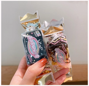 Detail of durable earth-tone hair ties in a candy-shaped crown container
